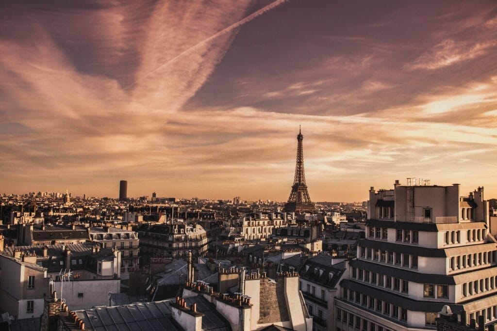 Paris rooftop skyline at sunset